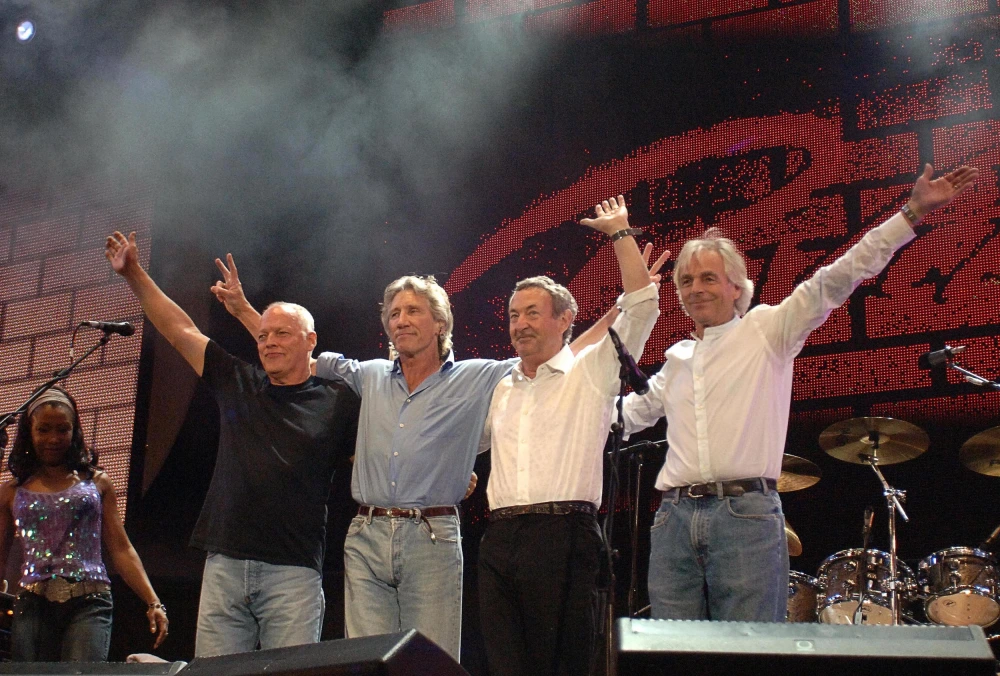 Pink Floyd (from left: David Gilmour, Roger Waters, Nick Mason and Richard Wright) taking a bow at the Live 8 concert in Hyde Park, London, in 2005.